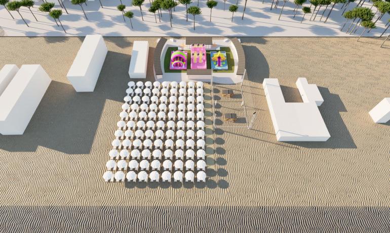 Strand mit Sonnenschirmen, Hüpfburgen und Strukturen.